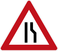 Road narrows on one side