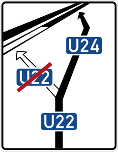 White direction sign with local destination